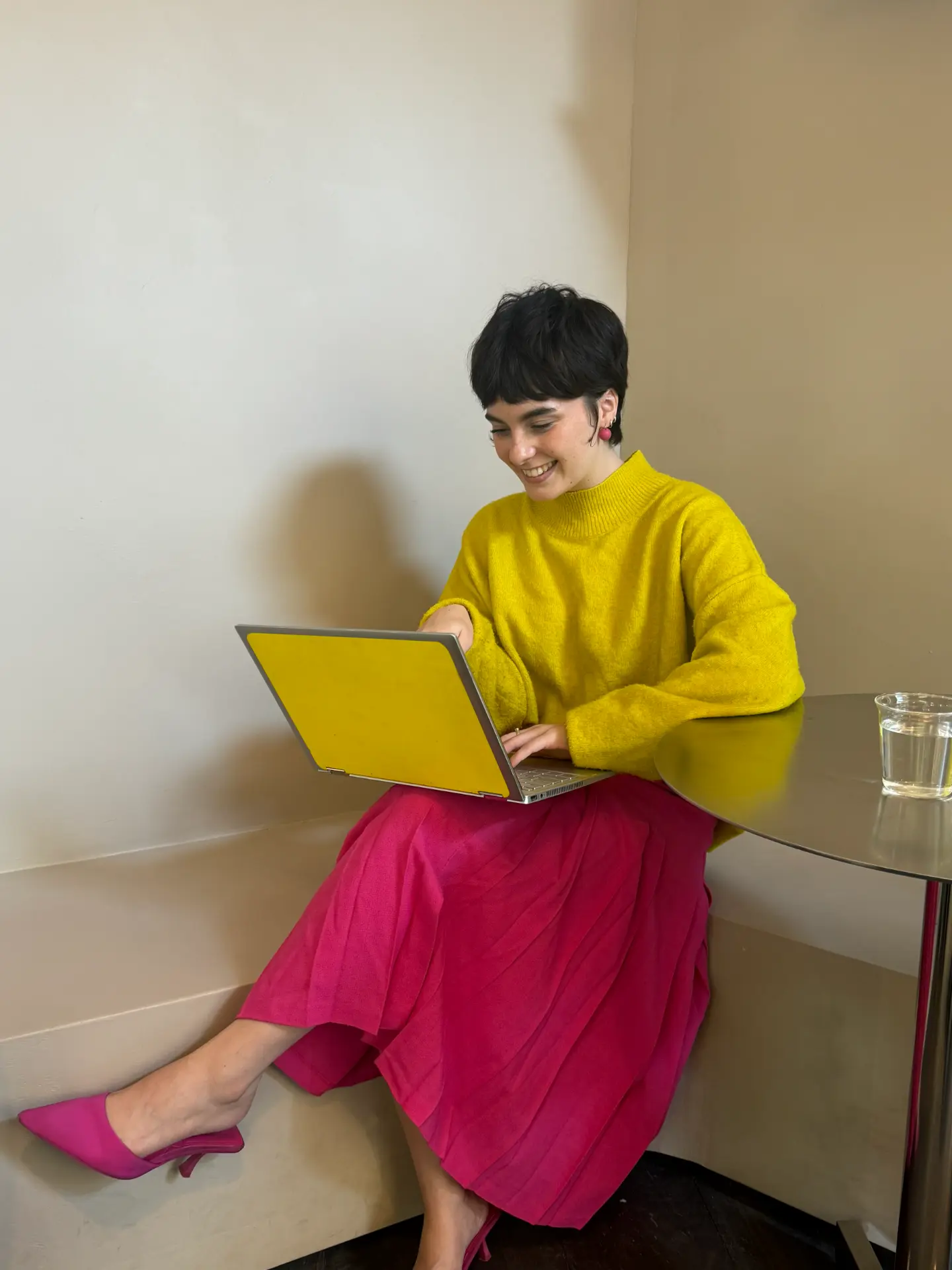 Rosie working on a laptop